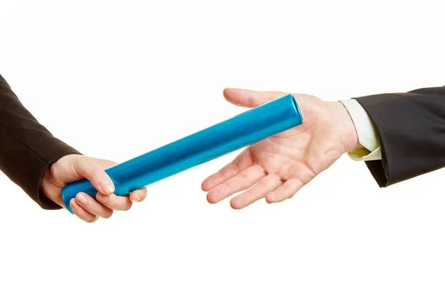 Zwei Geschäftsleute bei der Übergabe vom Staffelstab wie beim Staffellauf